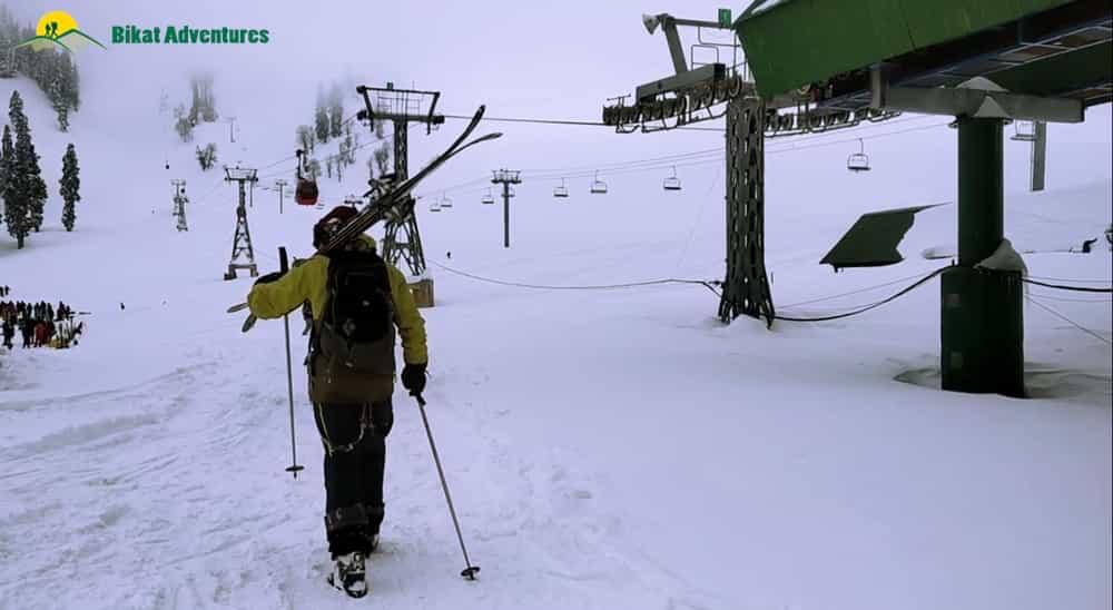 Skiers with their ski equipment Skiers with their ski equipment
